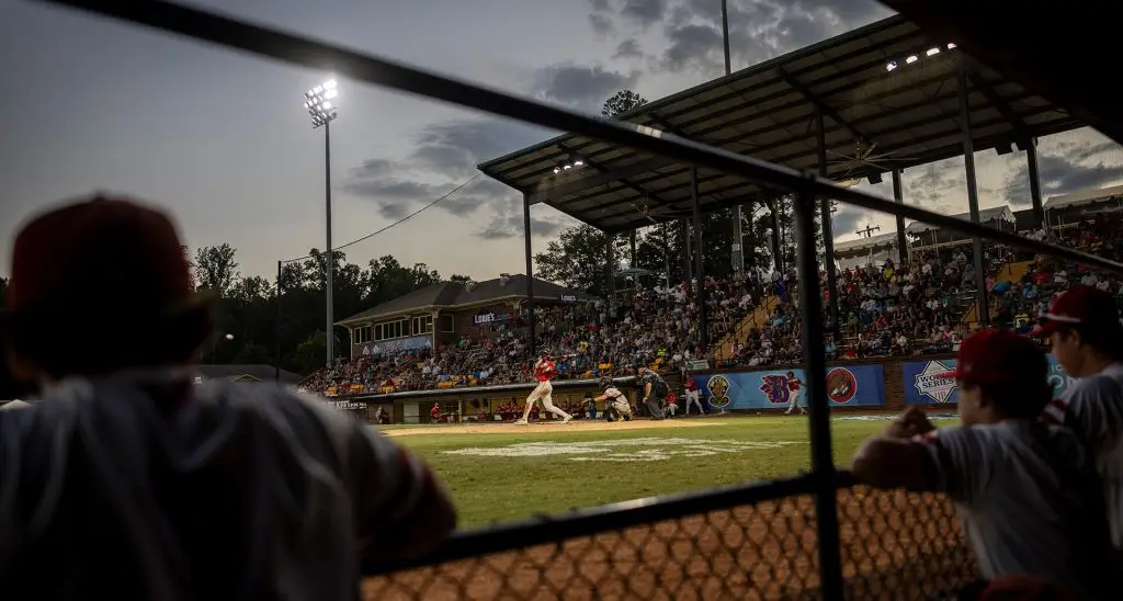 A batter at the American Legion World Series, viewed from the dugout.