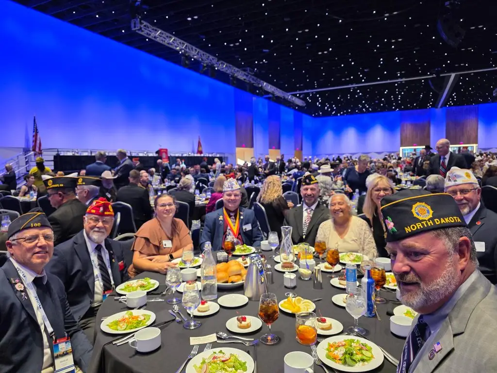 Legion members gathered around a table at an American Legion event.