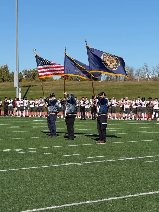 Post 3 color guard presents the colors at a Dickinson State University football game.